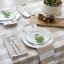 Linen House Revana Stone Check Tablecloth with plates and napkins
