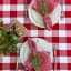 Linen House Revana Red Check Tablecloth with plates and napkins
