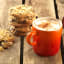 Le Creuset Stoneware Cappuccino Mug, 200ml - Flame on the wooden table with cookies