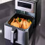 Russell Hobbs Super Nova Airfryer, 9L on the kitchen counter with food