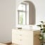 Umbra Hubba Arched Mirror - Brass In A Bedroom Setting 