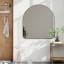 Umbra Hubba Arched Mirror - Metallic Titanium In A Living Room Setting 