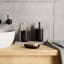 Umbra Junip Tumbler - Black with a soap dish next to the basin