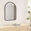 Umbra Hub Arched Mirror - Black In A Bedroom Setting 