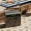 Fieldbar Gin Trunk - Oyster Grey next to a pool lounger
