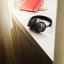 Bang & Olufsen Beoplay H95 Premium Noise Cancellation Headphones - Black on the table with a book