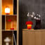Kooduu Sensa Table Lamp - Orange on a table