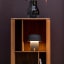 Kooduu Sensa Table Lamp - Anthracite on a shelf