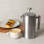 Yuppiechef Stainless Steel French Press - 1L closed with coffee cup and snacks