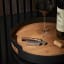 Eva Solo Liquid Lounge Waiter's Corkscrew on a table next to wine glass and open wine bottle