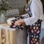 DSA Robyn Valerie Cosmos Full Bib Apron worn in the kitchen