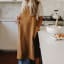 Me Thyme Cross-Over Apron - Tobacco worn in the kitchen