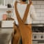 Me Thyme Cross-Over Apron - Tobacco worn in the kitchen