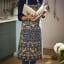 Ulster Weavers Whip Clean Finch and Flower Apron worn in the kitchen