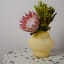Thread Office Curvy Vase on side table with flowers