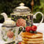 Jenna Clifford Botanica Rose Teapot, 1.2L on the table with a Botanical Rose Sugar Pot