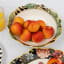 Jenna Clifford Botanica Rose Salad Bowl, 23cm with fruits on the table