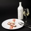 Gerard Bertrand Art De Vivre Clairette White Wine, 750ml next to plate of dessert