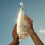 Gerard Bertrand Cote Des Roses Chardonnay, 750ml being held in the air
