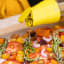 Zuutii Oil Dispenser, 500ml - Light Lemon with a salad
