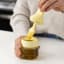 Zuutii Oil Dispenser with Brush, 130ml - Creamy Yellow on the table