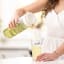 Zuutii Infusion Pitcher, 1.2L - Light Cream with a glass