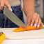 Zuutii Double-Sided Chopping Board - Light Cream slicing carrots