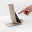 Blim Plus Stand Ladle Rest - Moka Grey with a phone