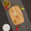 Pebbly Non-Magnetic Toast Tongs - Red on the table