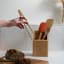 Pebbly Non-Magnetic Toast Tongs - Brown showing scale in hand