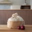 Pebbly Cotton Bag and Jute Storage Basket - Small on the table