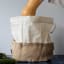 Pebbly Cotton Bag and Jute Storage Basket - Large on the table with butternut