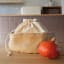 Pebbly Cotton Bag and Jute Storage Basket - Large on the kitchen counter