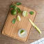 Pebbly Bread Board and Knives, Set of 5 on the table 