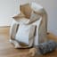 Pebbly Cotton Lunch Bag - Cream on the table