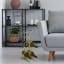 H & S Collection Gold Metal Wine Rack next to a couch