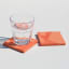 Alkaline Chunky Terrazzo Square Coasters, Set of 2 - Two-Tone Orange with a glass