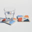 Alkaline Chunky Terrazzo Square Coasters, Set of 2 - Neutral detail with a glass of water