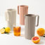 Blim Plus Hydria Carafe, 1.7L - Moka Grey on the table with other colours