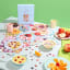 Piecework Puzzles Early Bird 1000 Piece Puzzle on the table with cereal bowels