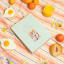 Piecework Puzzles Rise & Shine 1000 Piece Puzzle on a picnic blanket