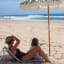 Sunnylife Reclining Beach Chair - The Vacay Olive on beach sand