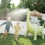 Sunnylife Giant Dino Sprinkler in the lawn