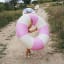 Sunnylife Tube Pool Ring - Bubblegum Pink showing scale