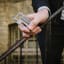 Gentlemens Hardware Titanium Coated Credit Card Tool showing sale on his hand