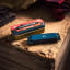 Gentlemens Hardware Campfire Harmonica on a wooden table