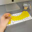 Kikkerland Cleaning Putty on a keypad