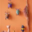 Studio ROOF Elephant Beetle Wall Decor on the wall with other designs