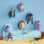 Studio ROOF Green Fig Beetle Wall Art on the wall with other designs