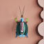 Studio ROOF Green Fig Beetle Wall Art on the wall